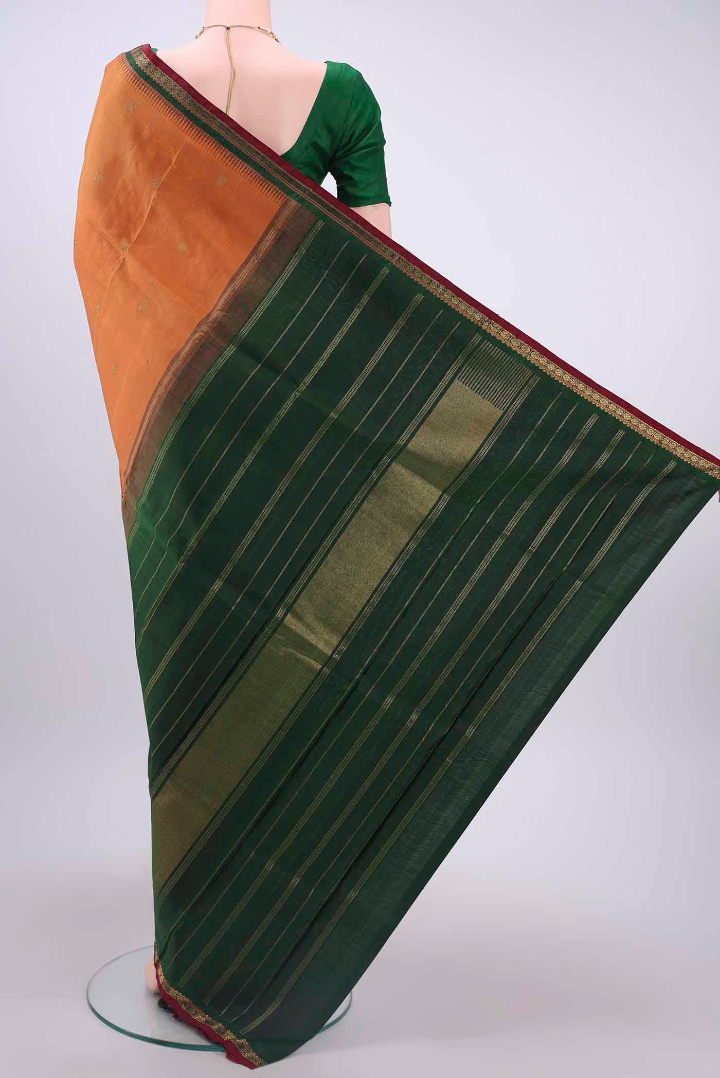 Flat view of Brick Orange Kanchipuram Silk Saree with Zari Butta on the body and Zari Border