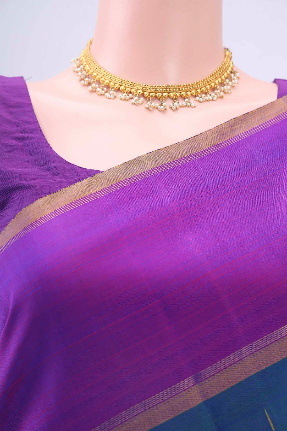 Border image of Pure Silk Pure Zari Peacock Blue Kanchipuram Saree with Zari Butta on the body and Plain Border