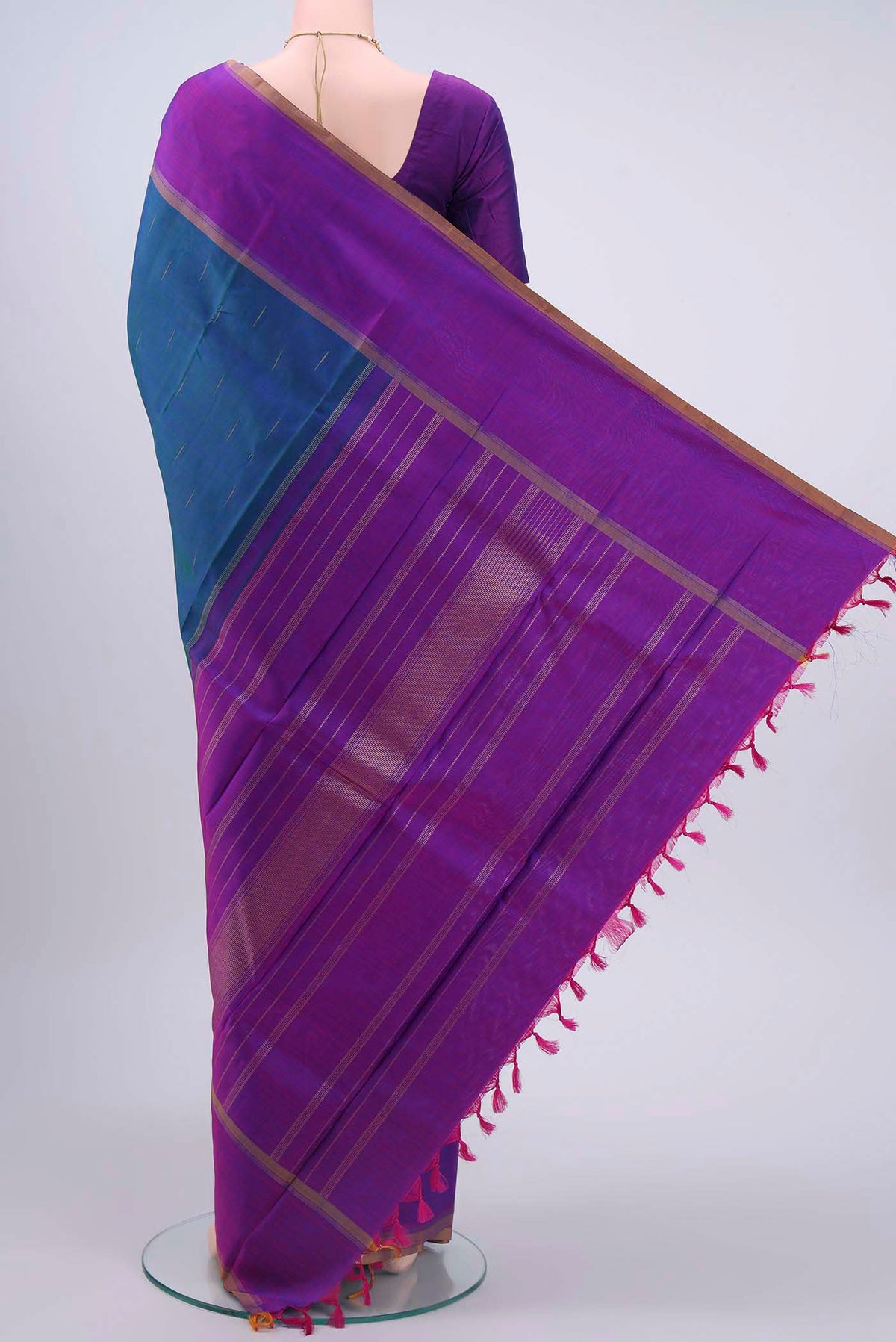 Flat view of Pure Silk Pure Zari Peacock Blue Kanchipuram Saree with Zari Butta on the body and Plain Border