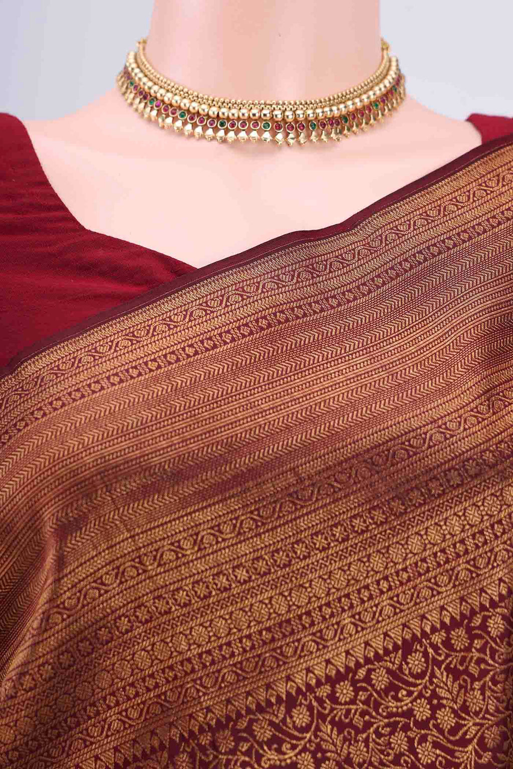 Border image of Maroon Kanchipuram Saree with Zari Brocade on the body and Zari Border
