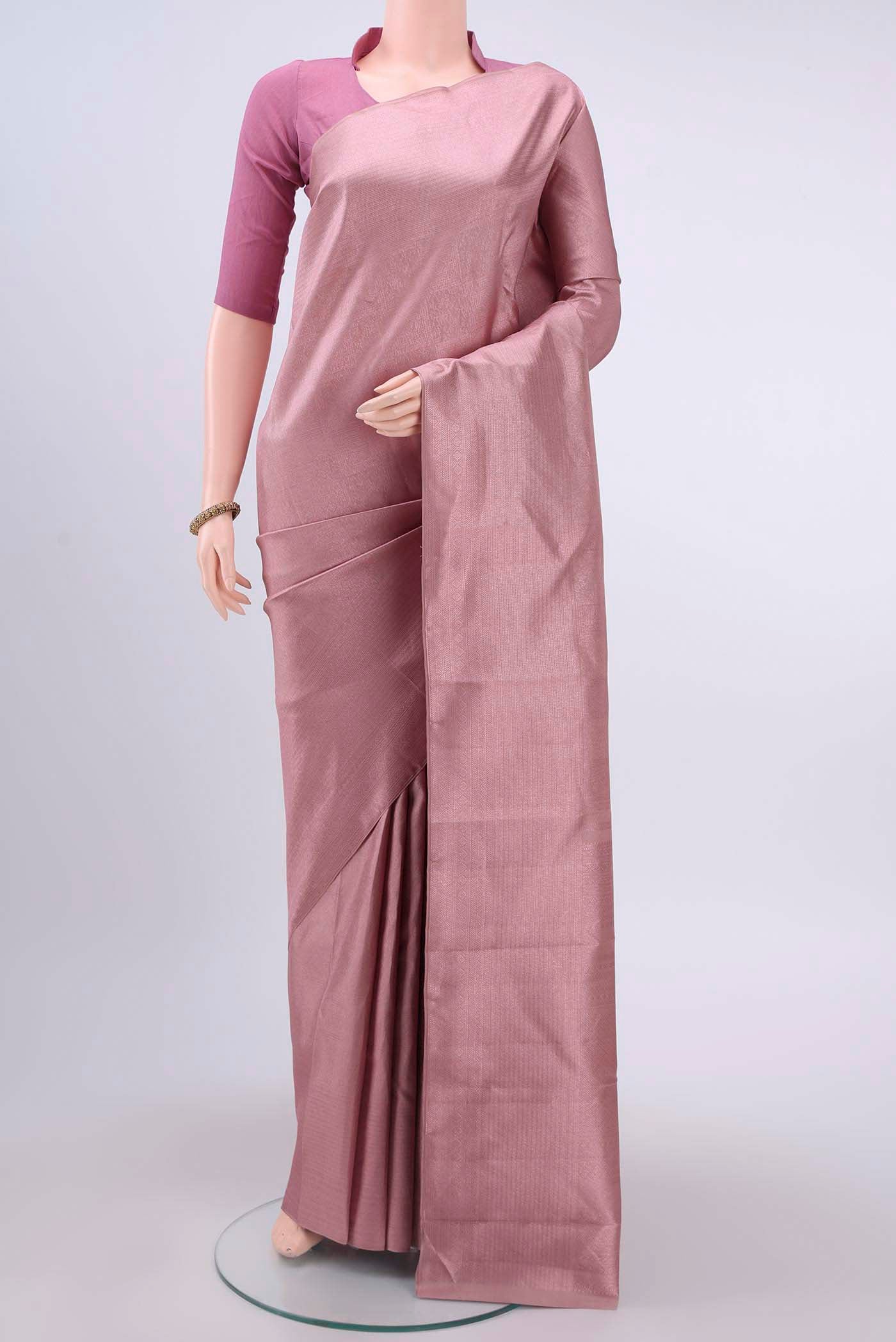 Mauve Kanchipuram Silk Saree with Zari Brocade on the body and Zari Border displayed on a mannequin