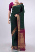 Bottle Green Dual Tone Kanchipuram Saree with Zari Butta on the body and Zari Border displayed on a mannequin