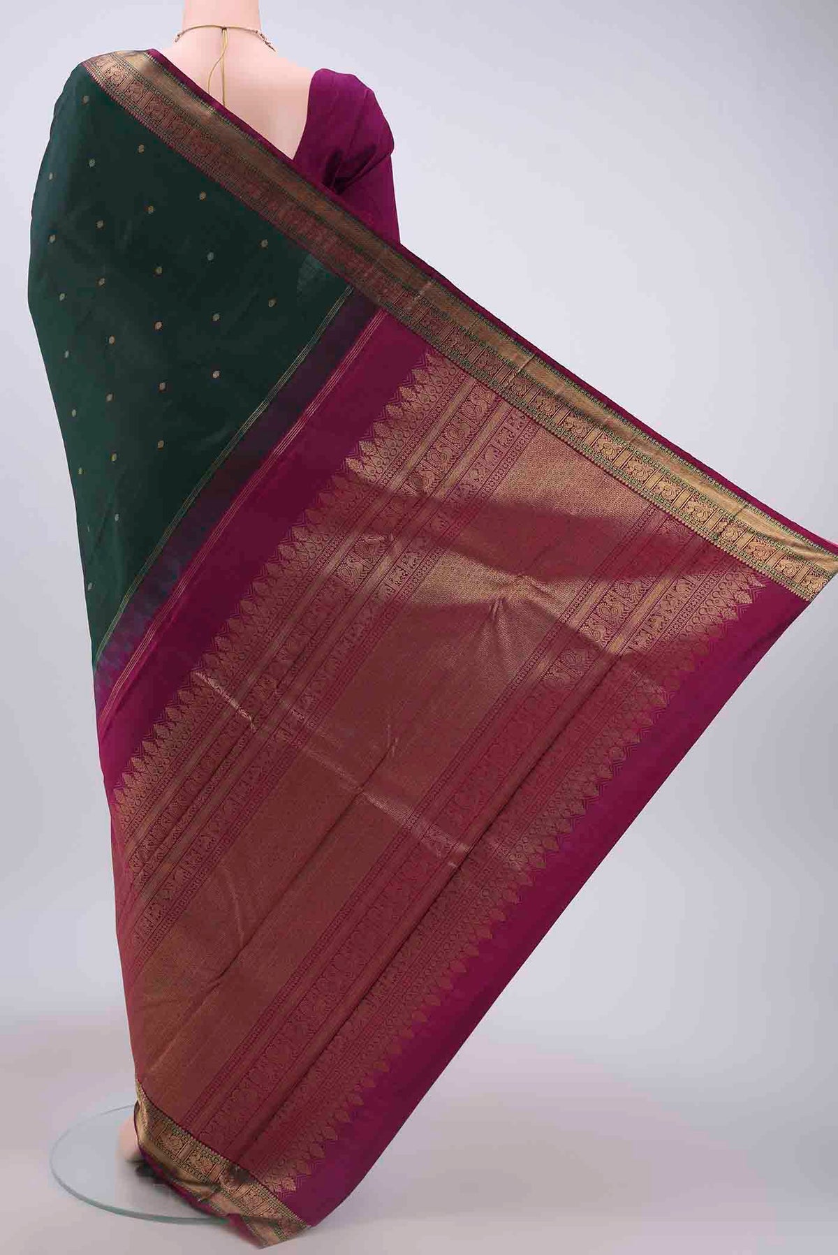 Flat view of Bottle Green Dual Tone Kanchipuram Saree with Zari Butta on the body and Zari Border