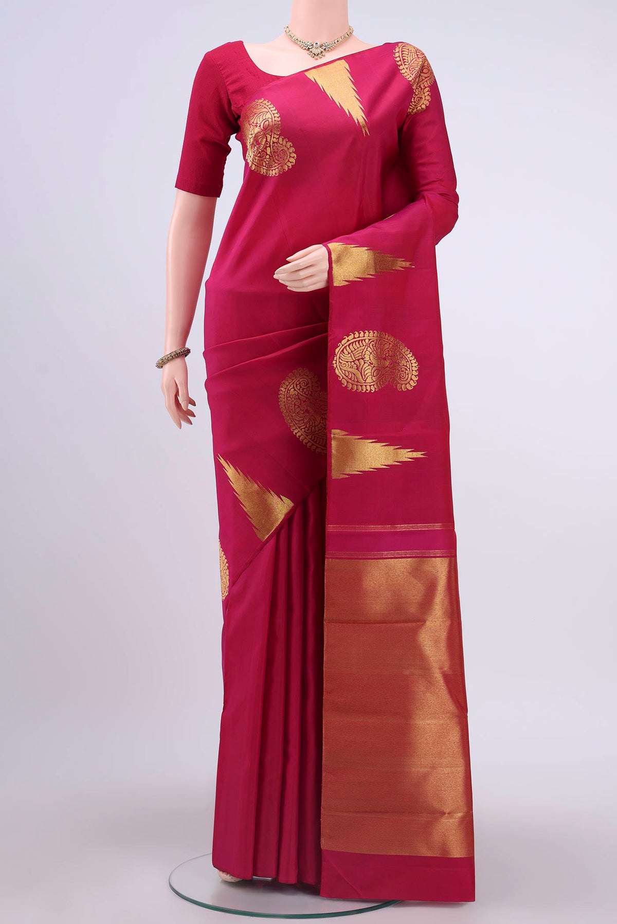Pink Dual Tone Kanchipuram Silk Saree with Zari Butta on the body and Temple Border displayed on a mannequin