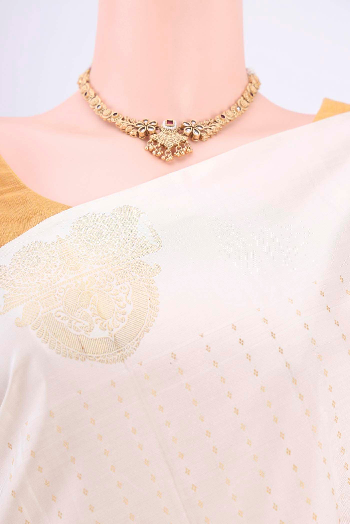 Border image of Pure Silk Pure Zari Off White Kanchipuram Saree with Zari Butta on the body and Zari Border