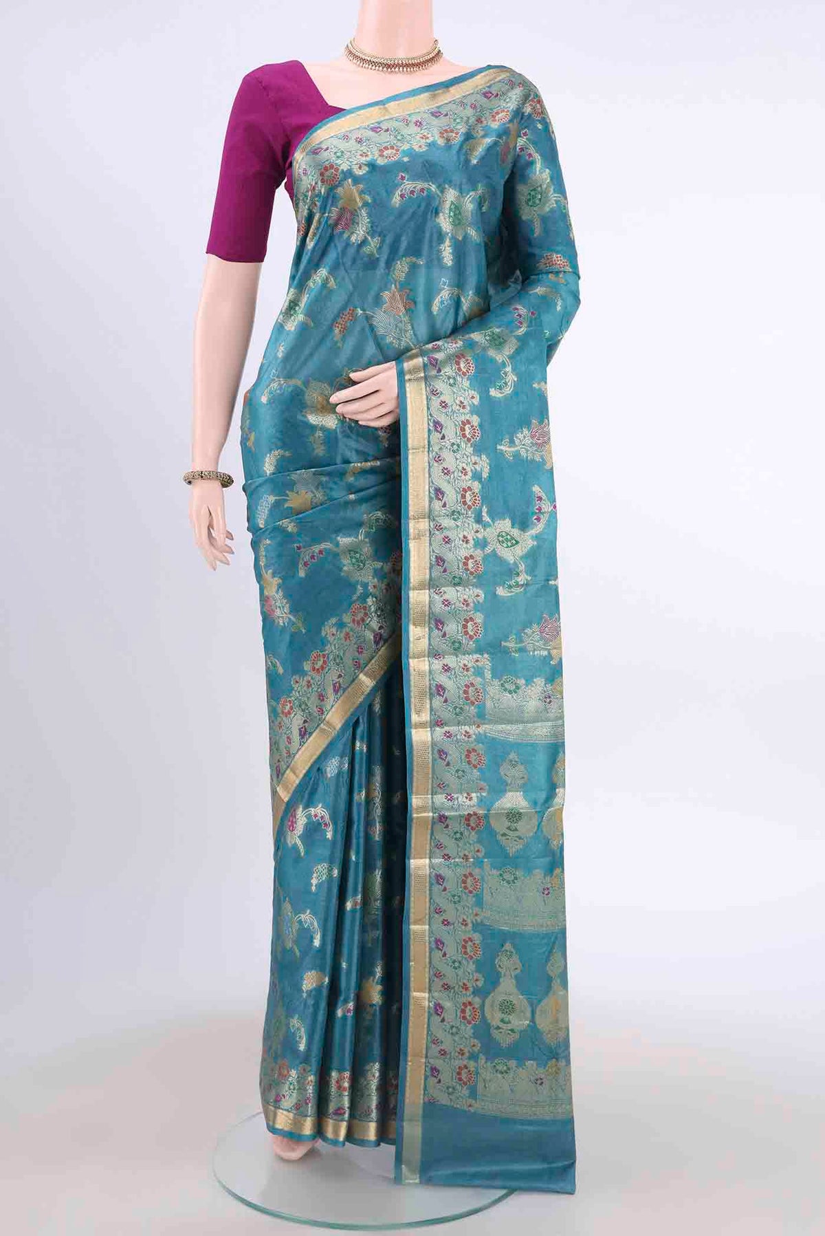 Blue Banarasi Tussar Silk Saree with Zari And Thread Butta on the body and Zari And Thread Border displayed on a mannequin