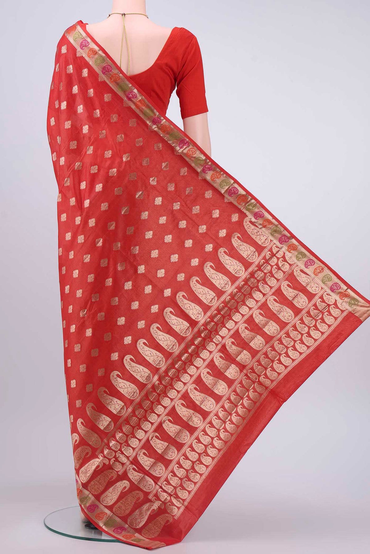 Flat view of Red Banarasi Tussar Silk Saree with Zari Butta on the body and Zari And Thread Border
