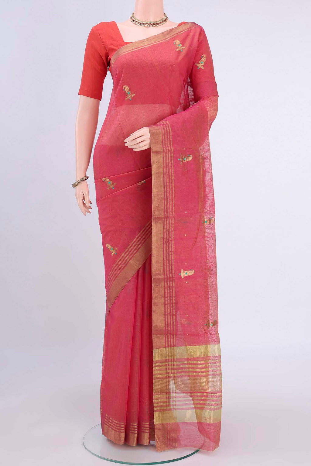 Coral Chanderi Silk Cotton Saree with Zari Butta on the body and Zari Border displayed on a mannequin