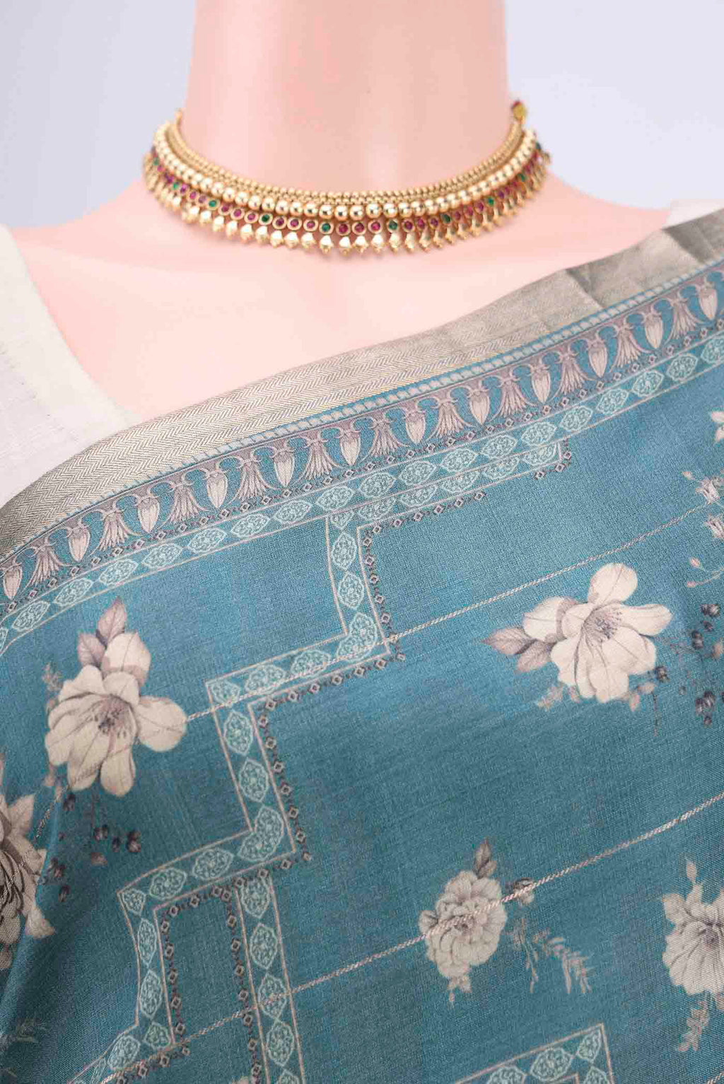 Border image of Maya Blue Dual Tone Tussar Silk Saree with Printed design on the body and Zari And Thread Border. 