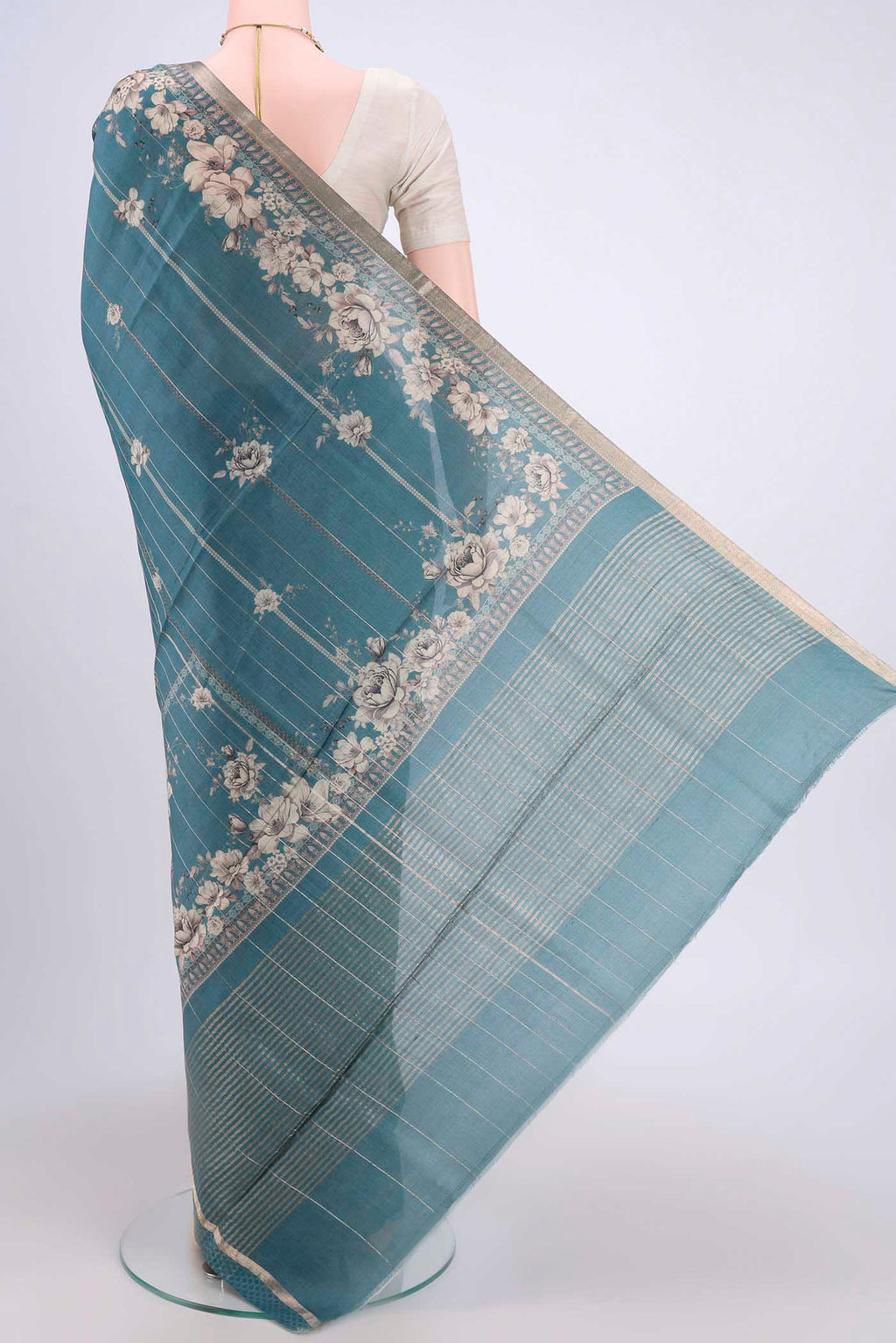 Flat view of Maya Blue Dual Tone Tussar Silk Saree with Printed design on the body and Zari And Thread Border. 