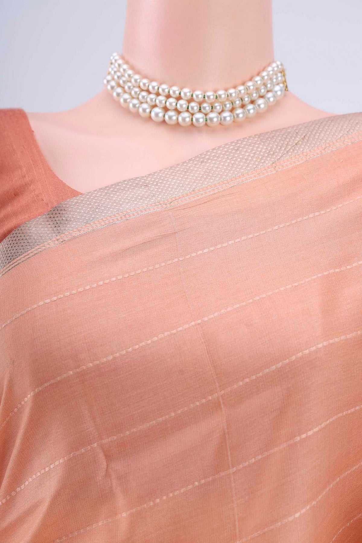 Border image of Peach Tussar Silk Saree with Floral Print on the body and Zari Border
