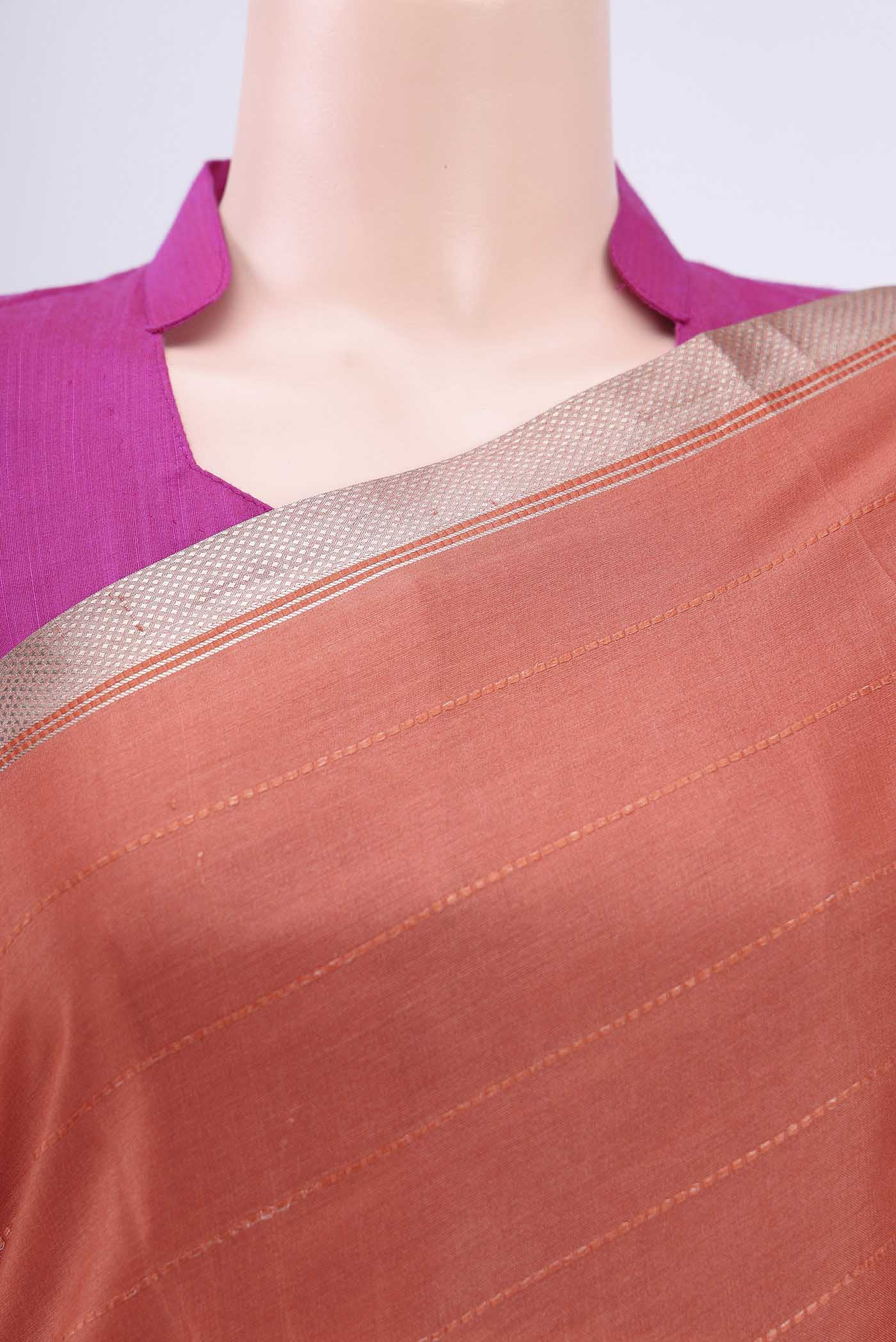 Border image of Rust Tussar Silk Saree with Printed design on the body and Zari Border. 