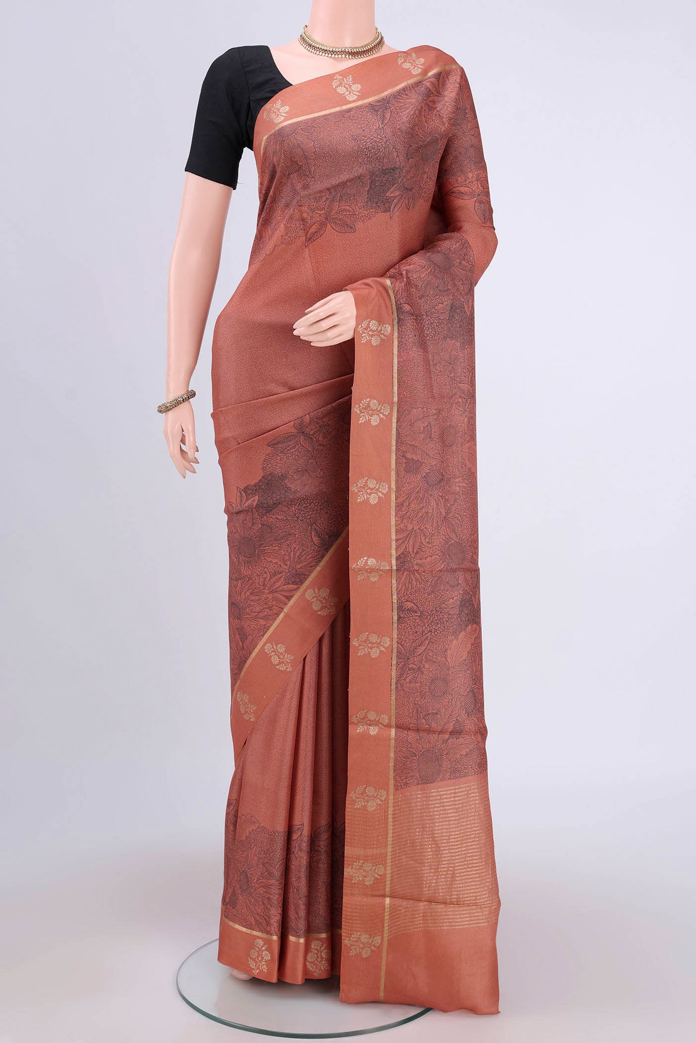 Brown Dual Tone Tussar Silk Saree with Printed design on the body and Zari And Thread Border.  displayed on a mannequin