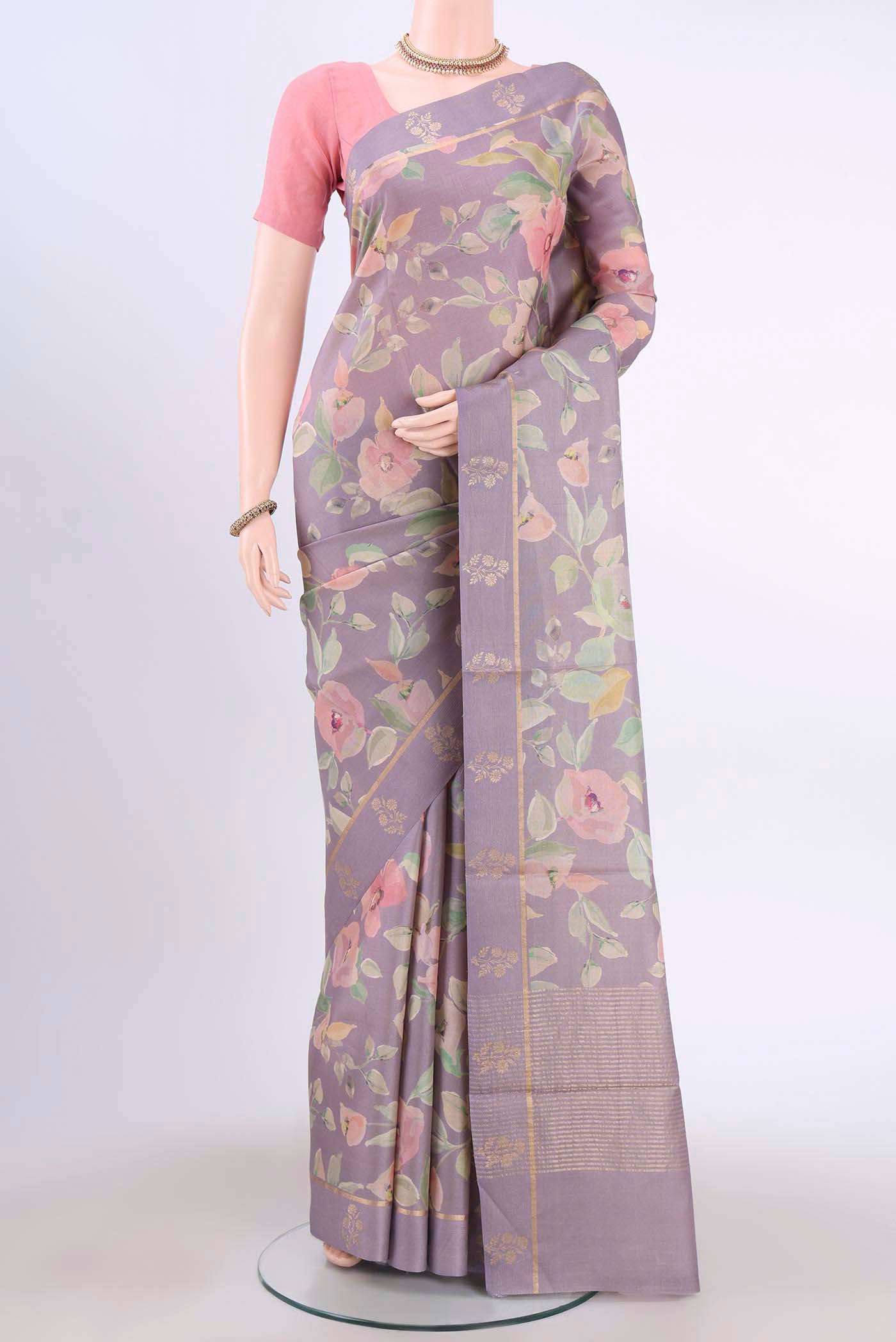 Mauve Tussar Silk Saree with Floral Print on the body and Zari Border displayed on a mannequin