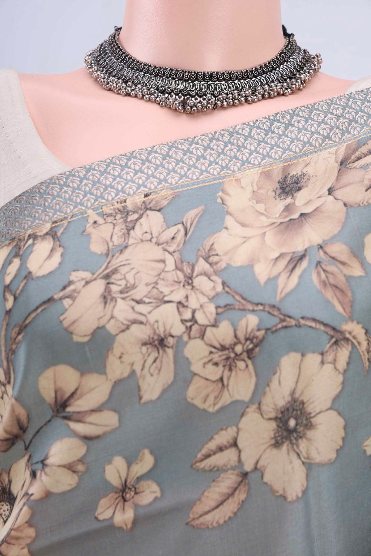 Border image of Grey Tussar Silk Saree with Floral Print on the body and Zari Border