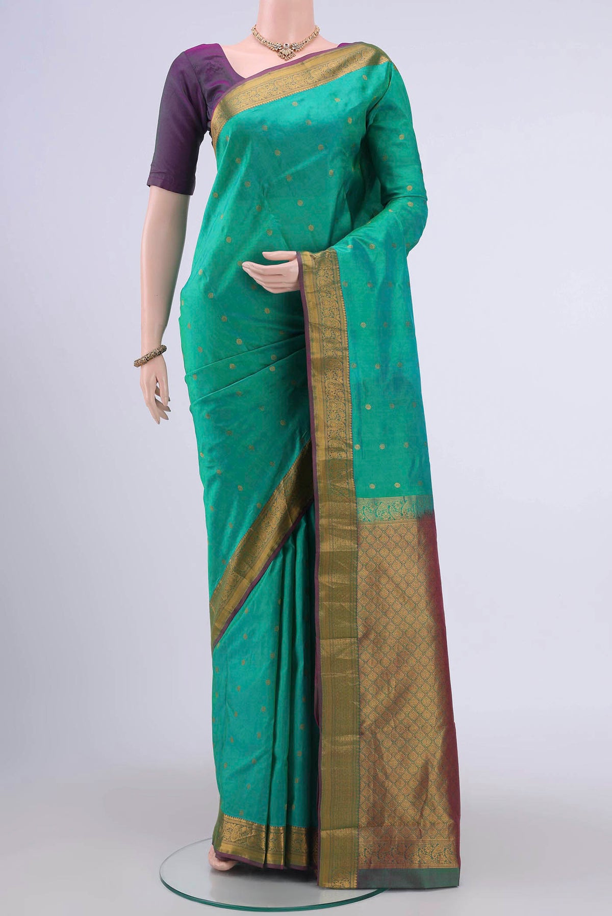 Sea Green Nangavalli Silk [ Salem ] Saree with Zari Butta on the body and Zari Border displayed on a mannequin