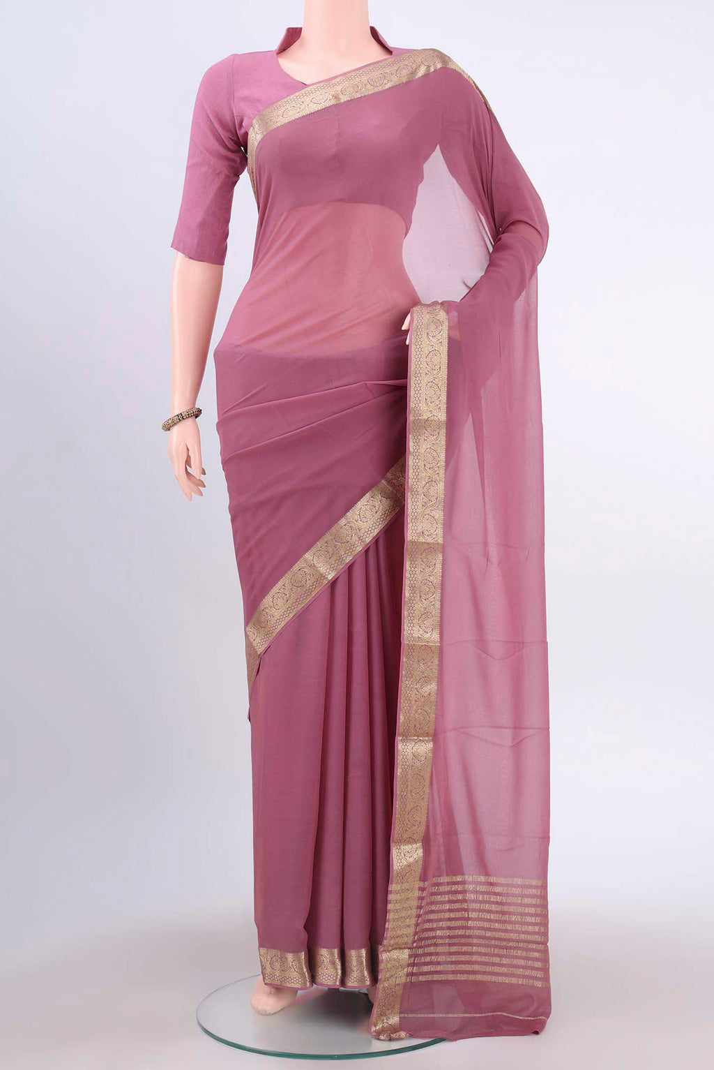 Light Magenta Mysore Georgette Saree with Plain Body and Zari Border displayed on a mannequin