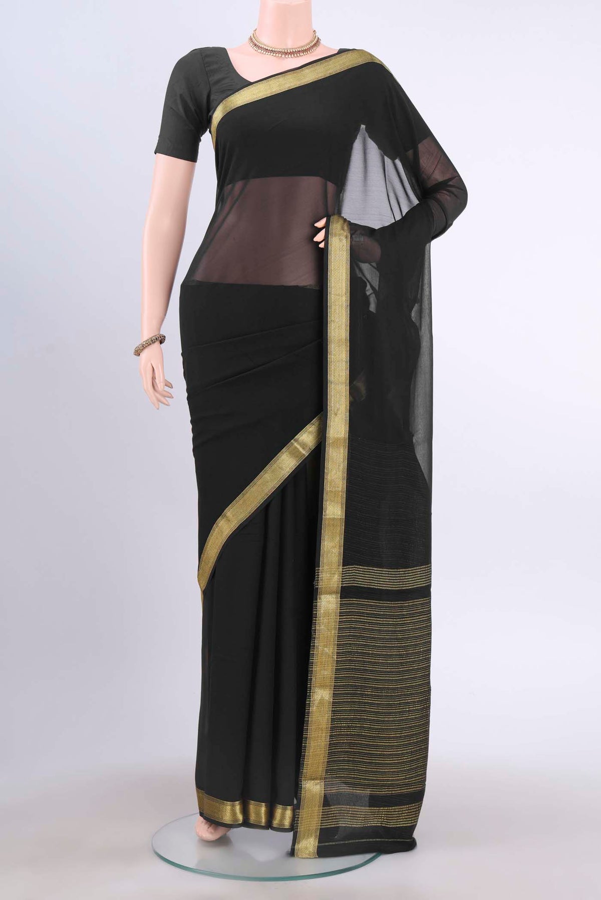 Black Mysore Georgette Saree with Plain Body and Zari Border displayed on a mannequin