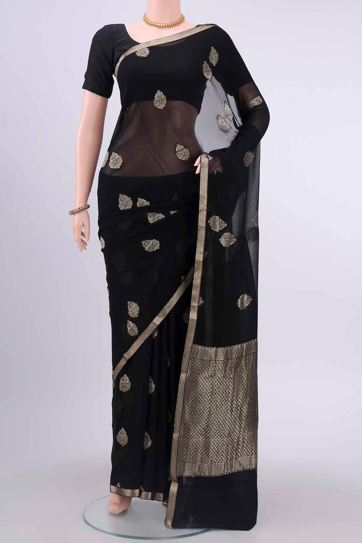 Black Mysore Georgette Saree with Zari Butta on the body and Zari Border displayed on a mannequin