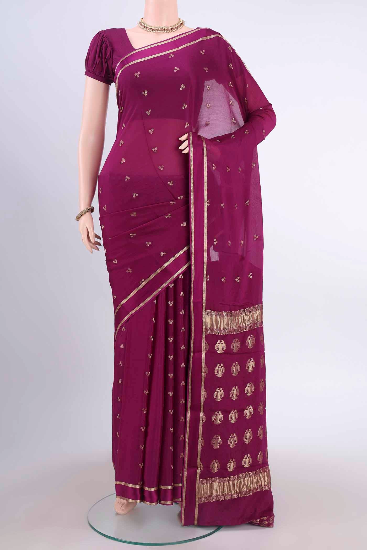 Magenta Mysore Crepe Saree with Zari Butta on the body and Satin Border displayed on a mannequin