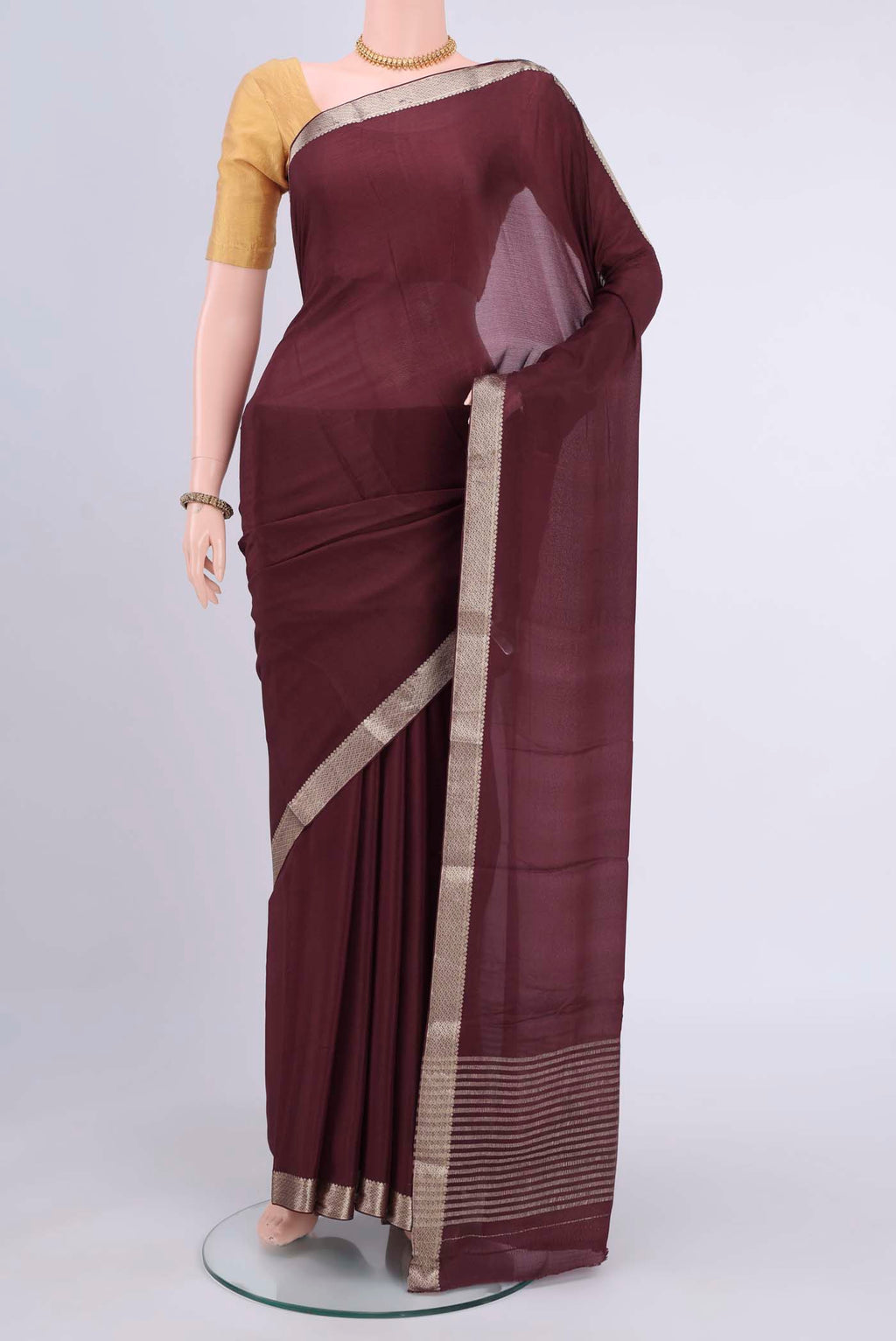 Burgundy Mysore Chiffon Saree with Plain Body and Zari Border displayed on a mannequin
