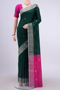 Green Uppada Silk Saree with Polka Dots on the body and Zari Border displayed on a mannequin