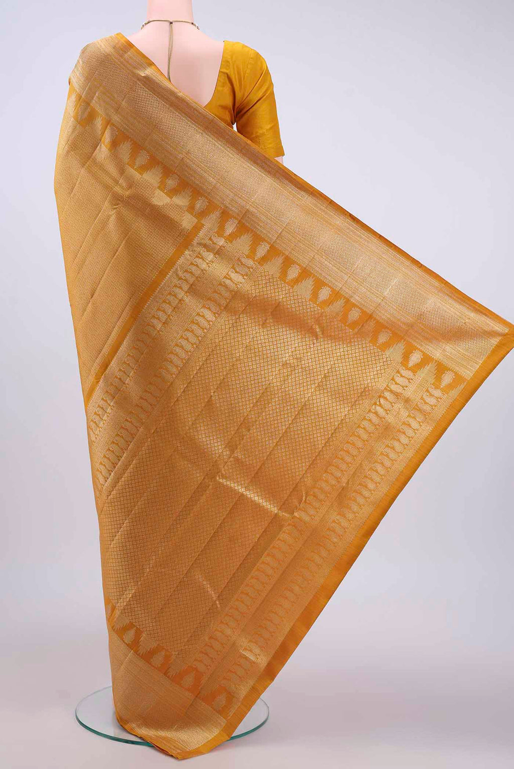 Flat view of Mustard Kanchipuram Silk Saree with Zari Brocade on the body and Zari Border