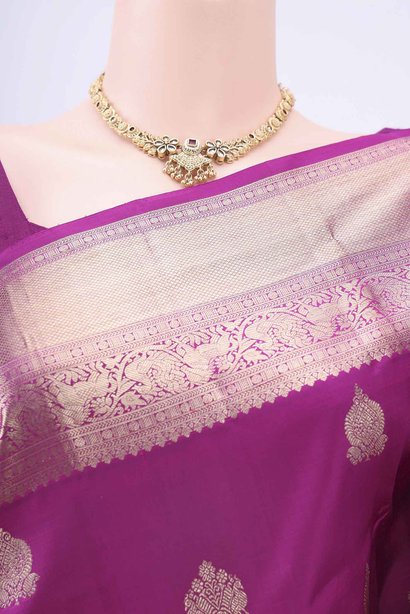 Border image of Magenta Kanchipuram Silk Saree with Zari Butta on the body and Zari Border