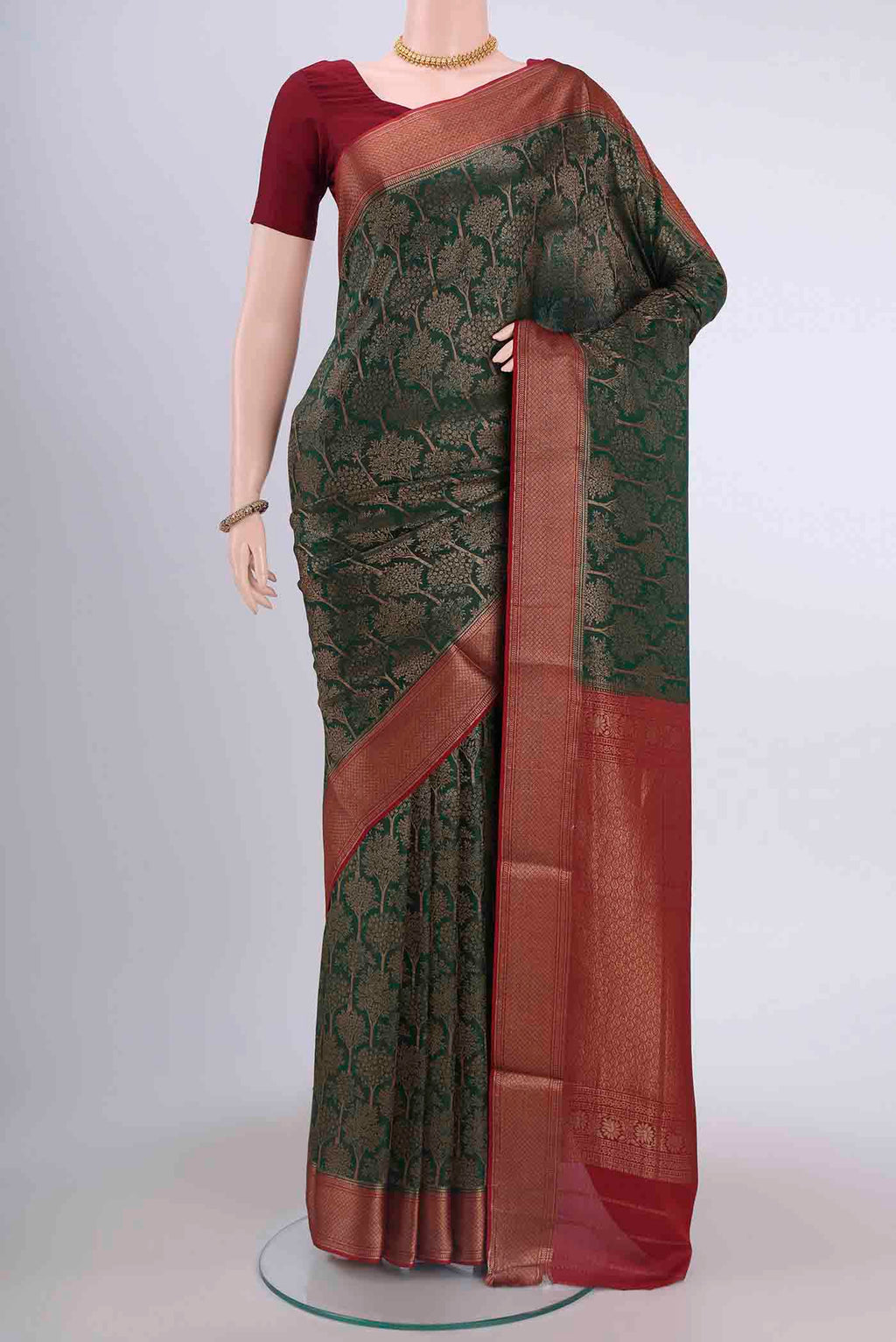 Bottle Green Dual Tone Mysore Crepe Saree with Zari Brocade on the body and Zari Border displayed on a mannequin