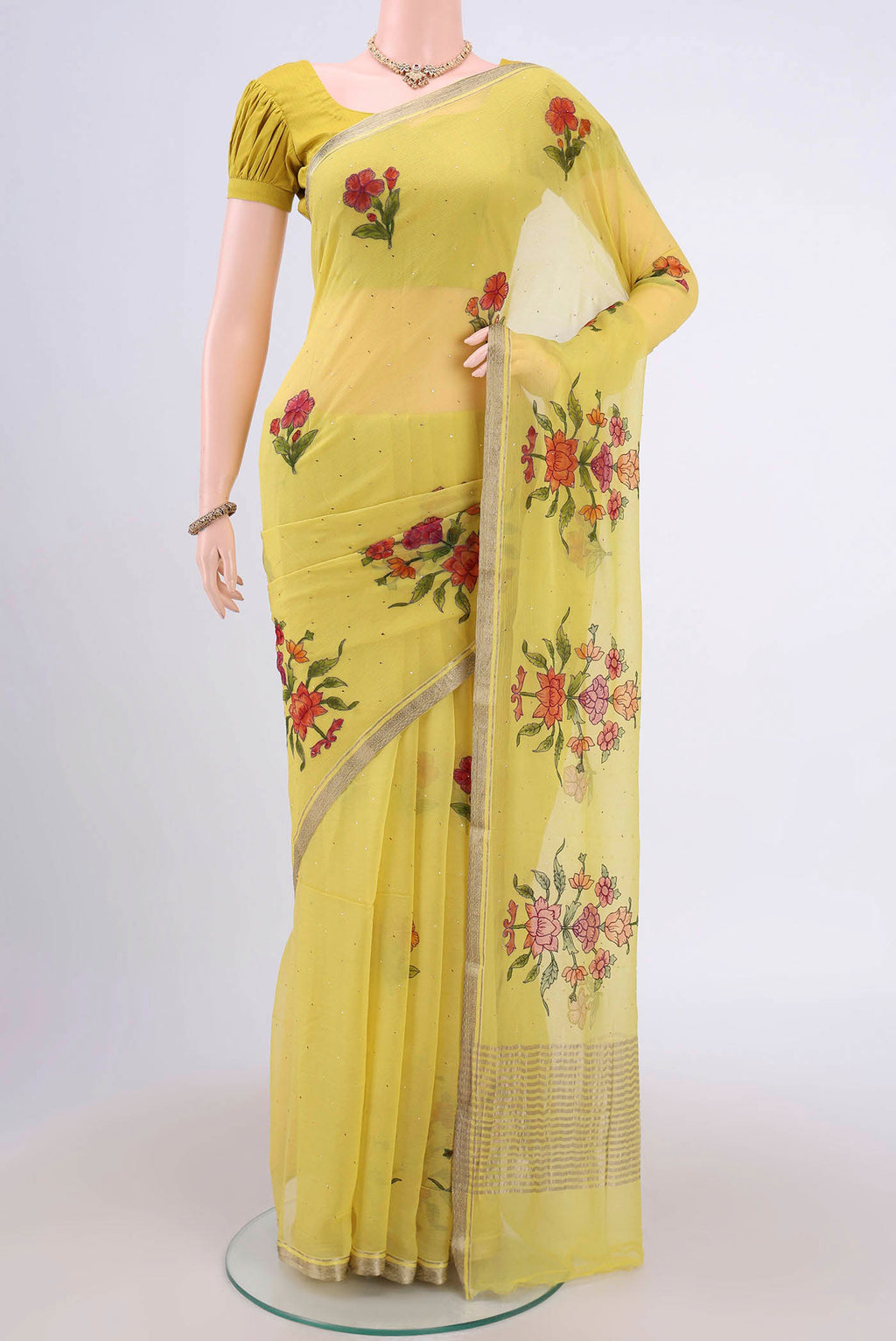 Lemon Yellow Mysore Chiffon Saree with Printed design on the body and Zari Border.  displayed on a mannequin