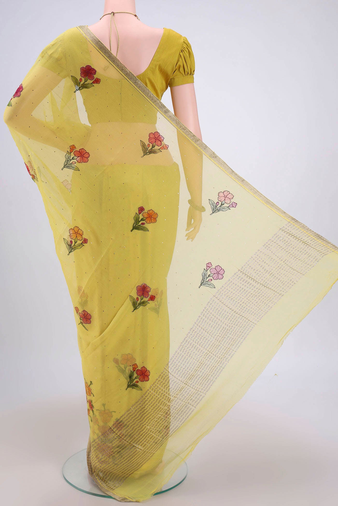 Flat view of Lemon Yellow Mysore Chiffon Saree with Printed design on the body and Zari Border. 
