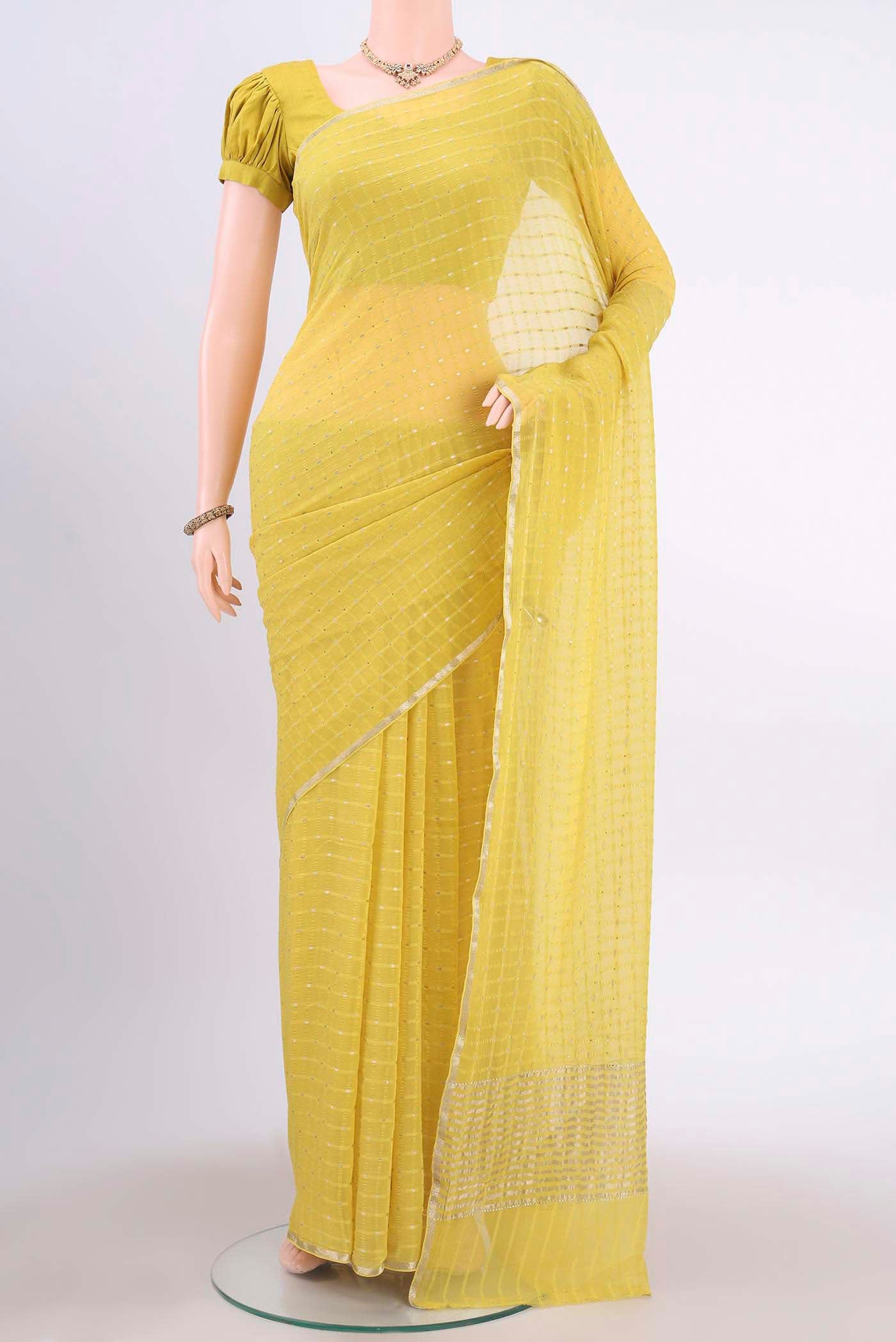 Lemon Yellow Mysore Chiffon Saree with Checked design on the body and Thin Zari Line displayed on a mannequin