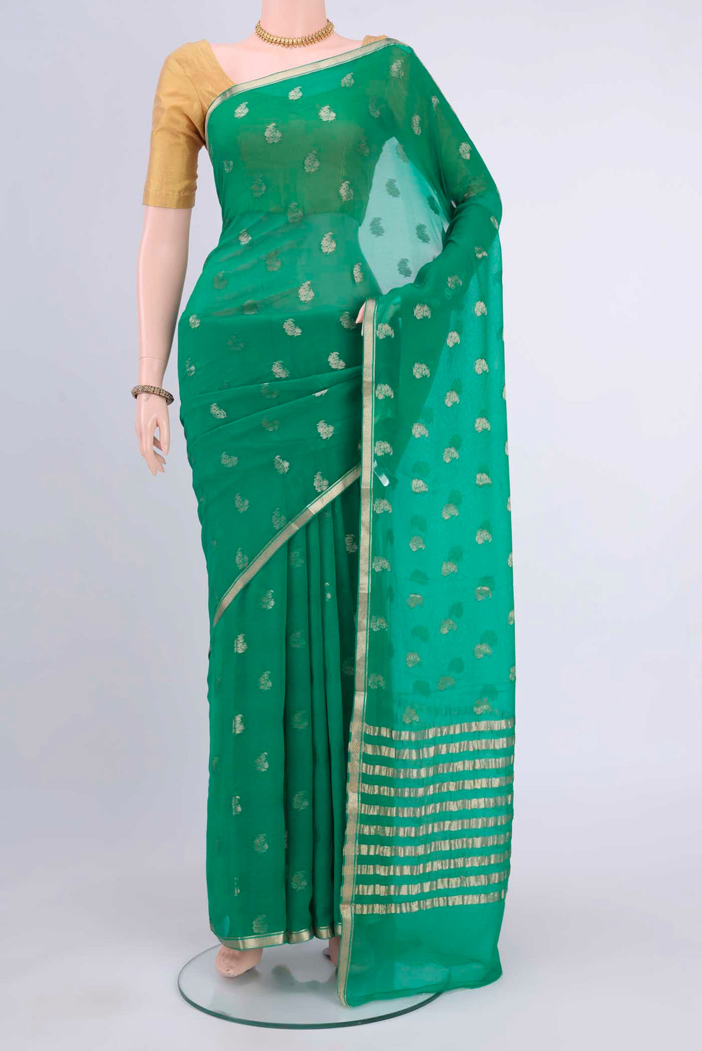 Green Mysore Chiffon Saree with Zari Butta on the body and Zari Border displayed on a mannequin