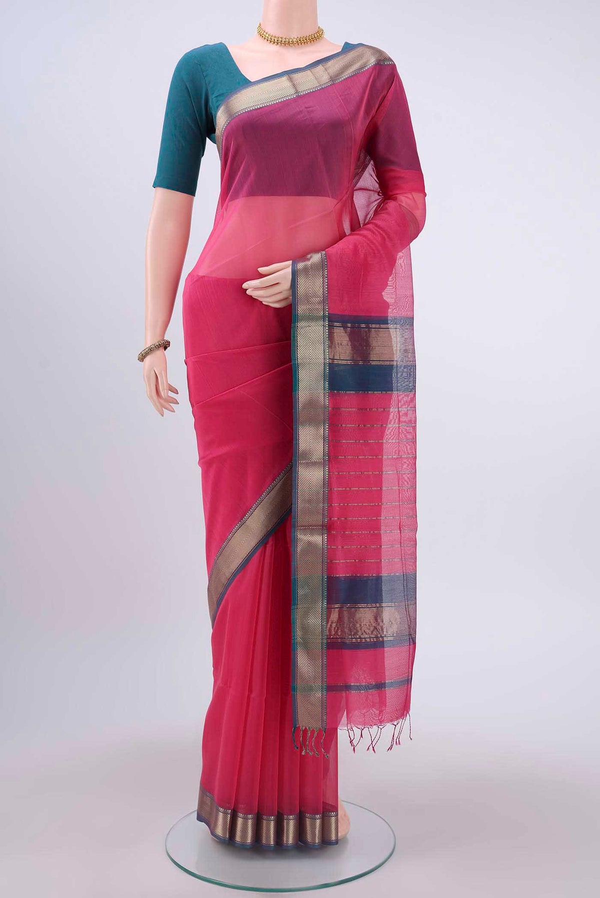 Pink Maheshwari Silk Cotton Saree with Plain Body and Zari Border displayed on a mannequin