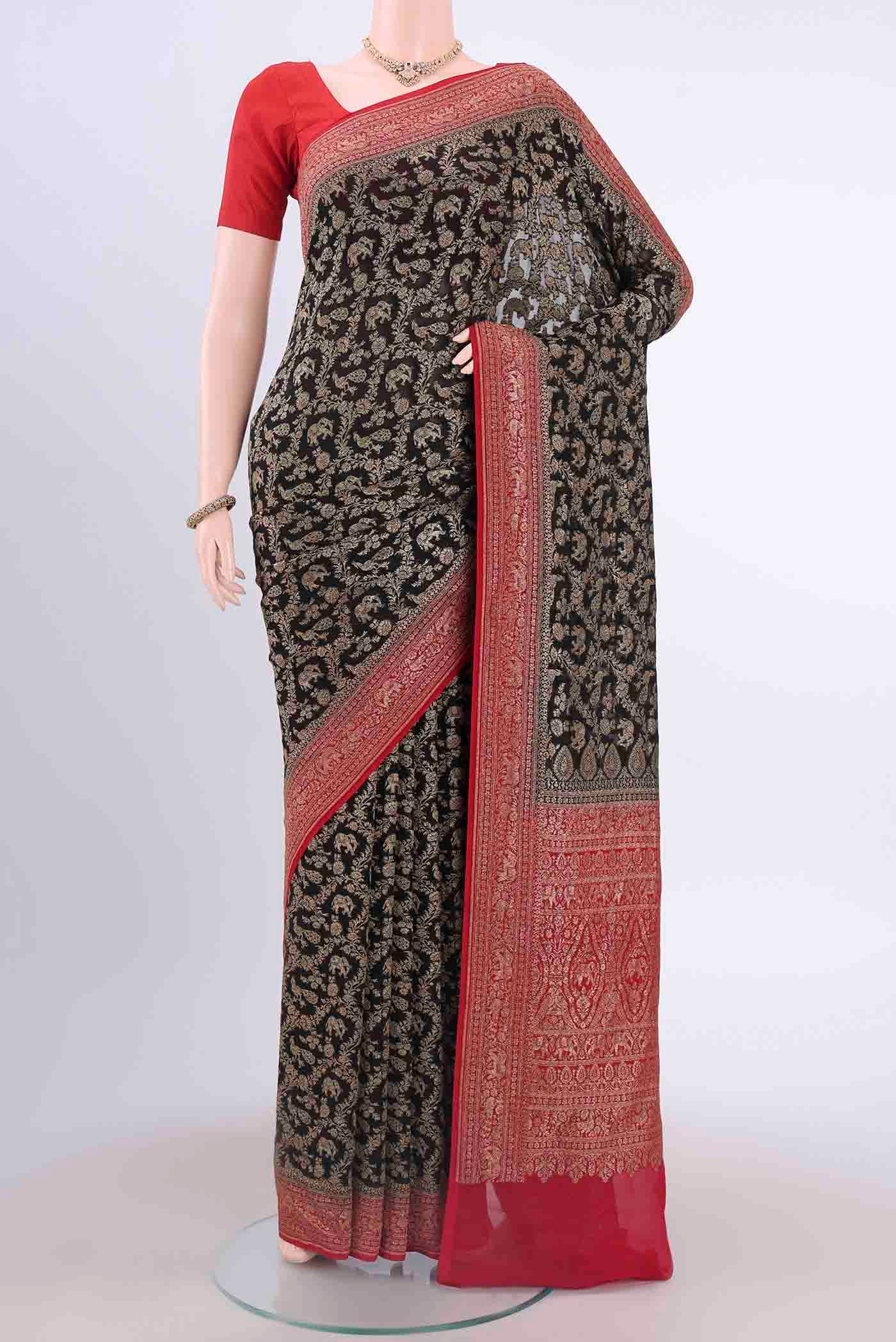 Black Banarasi Georgette Saree with Zari Brocade on the body and Zari Border displayed on a mannequin