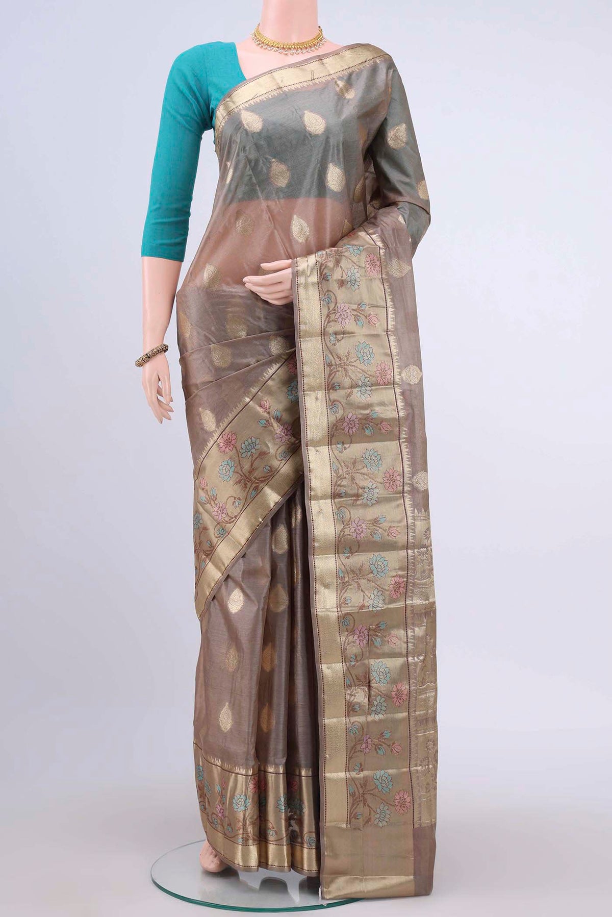 Dark Beige Banarasi Raw Silk Saree with Zari Butta on the body and Zari Border displayed on a mannequin