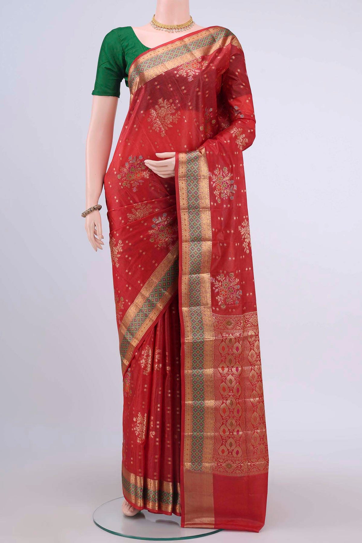 Red Banarasi Raw Silk Saree with Zari Butta on the body and Zari And Thread Border displayed on a mannequin