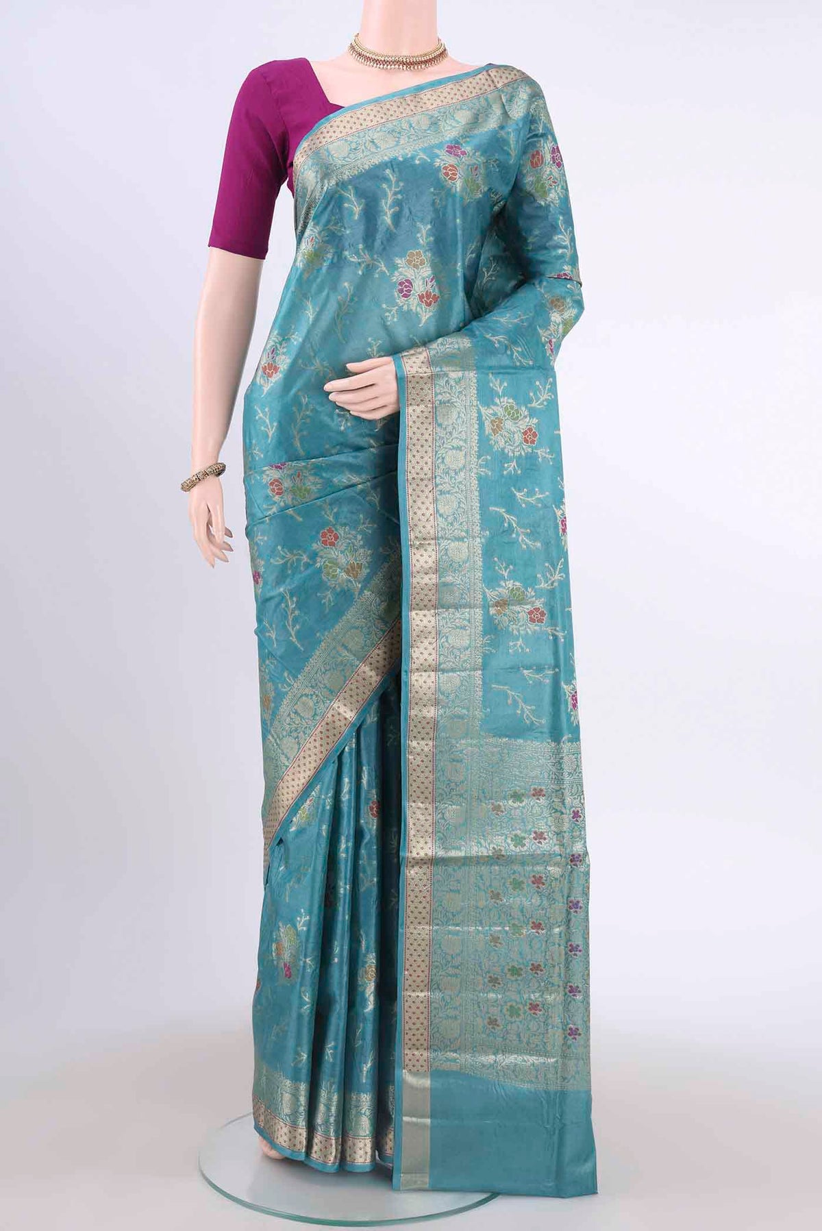 Blue Banarasi Tussar Silk Saree with Zari And Thread Butta on the body and Zari And Thread Border displayed on a mannequin