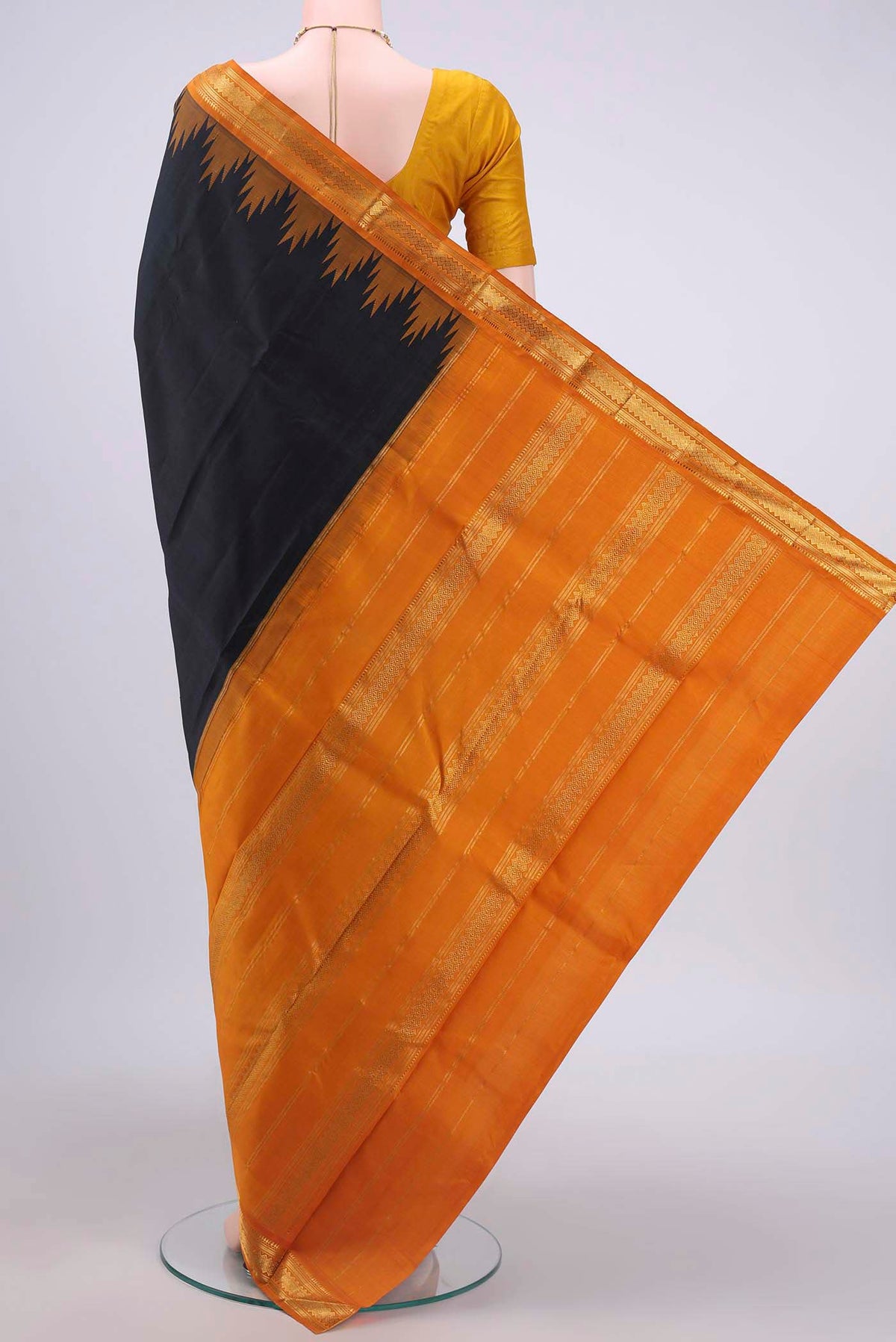 Flat view of Pure Silk Pure Zari Black Kanchipuram Saree with Plain Body and Zari Border