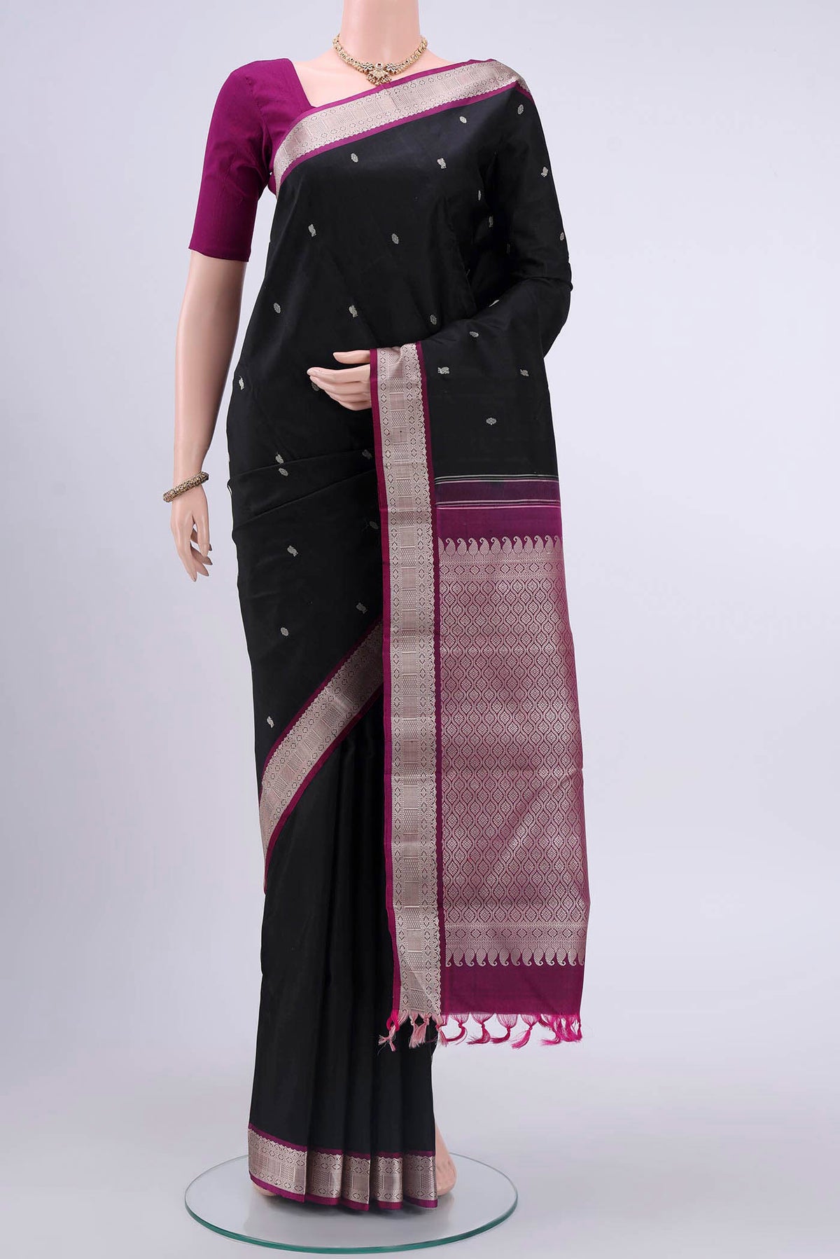 Black Kanchipuram Silk Saree with Thread Butta on the body and Thread Border displayed on a mannequin