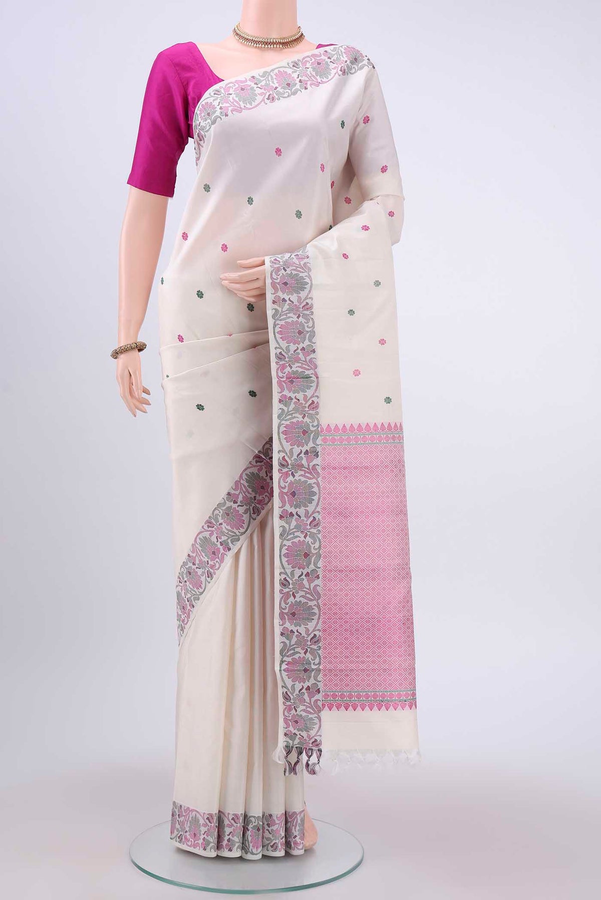 White Kanchipuram Silk Saree with Thread Butta on the body and Thread Border displayed on a mannequin