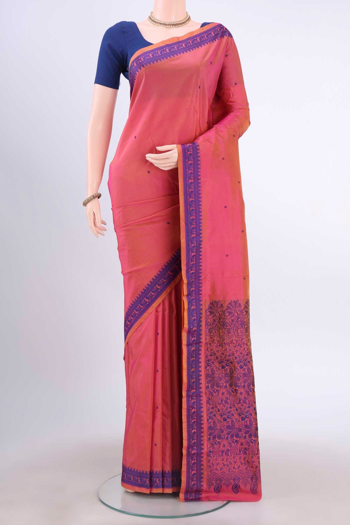 Pinkish Yellow Dual Tone Kanchipuram Silk Saree with Thread Butta on the body and Thread Border displayed on a mannequin