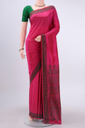 Dark Pink Kanchipuram Silk Saree with Thread Butta on the body and Thread Border displayed on a mannequin
