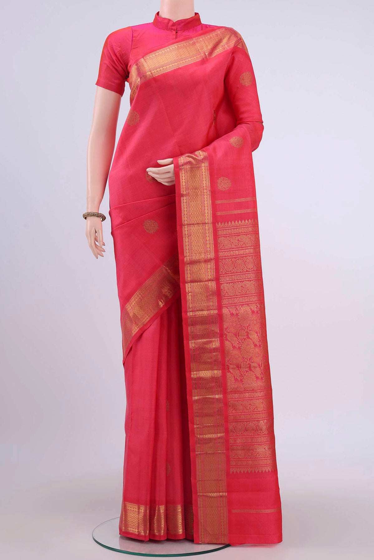Pure Silk Pure Zari Imperial Red Kanchipuram Saree with Zari Butta on the body and Zari Border displayed on a mannequin