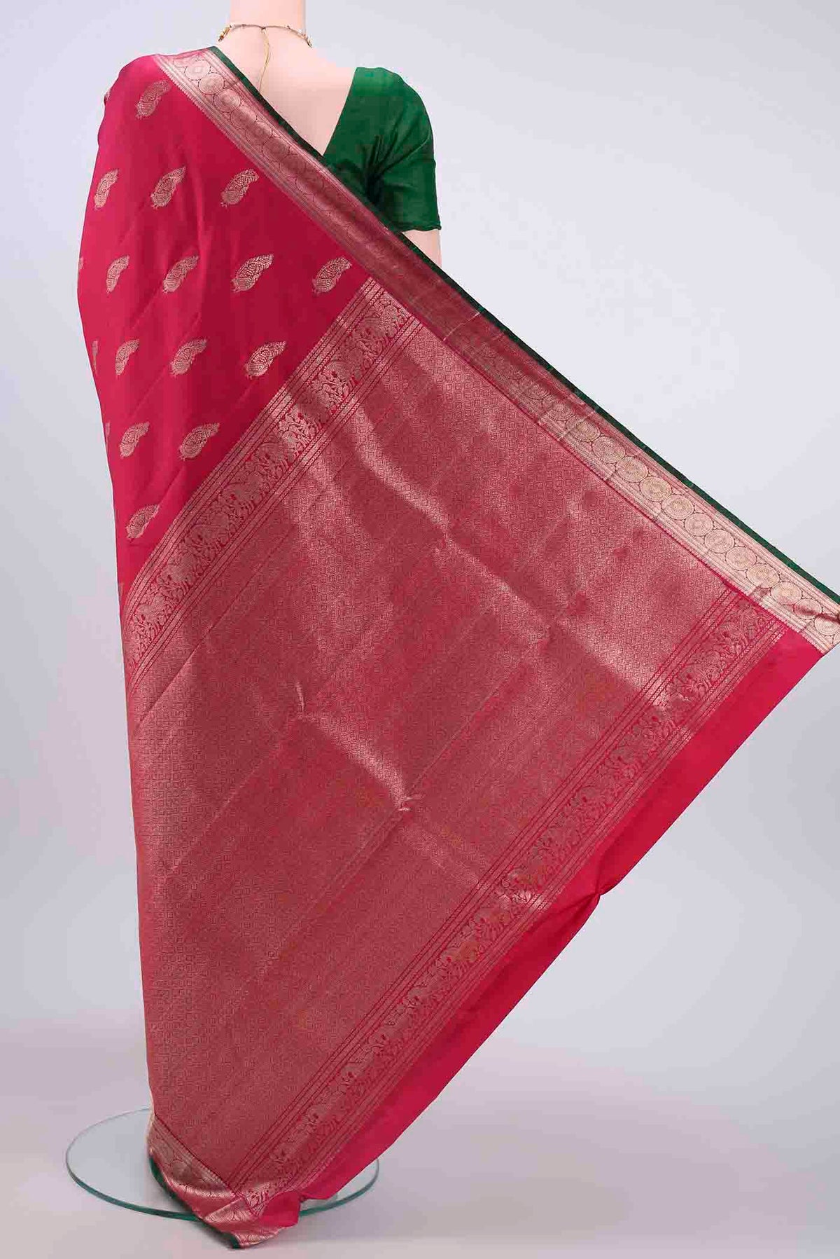 Flat view of Dark Pink Kanchipuram Saree with Zari Butta on the body and Zari Border
