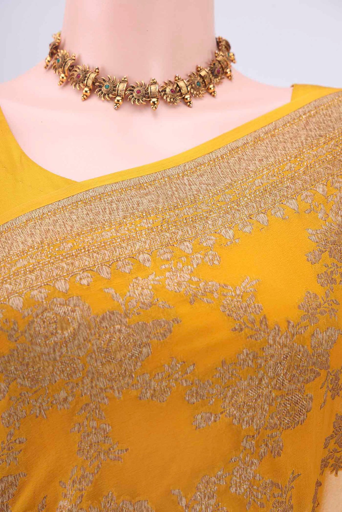 Border image of Mustard Banarasi Georgette Saree with Zari Butta on the body and Zari Border