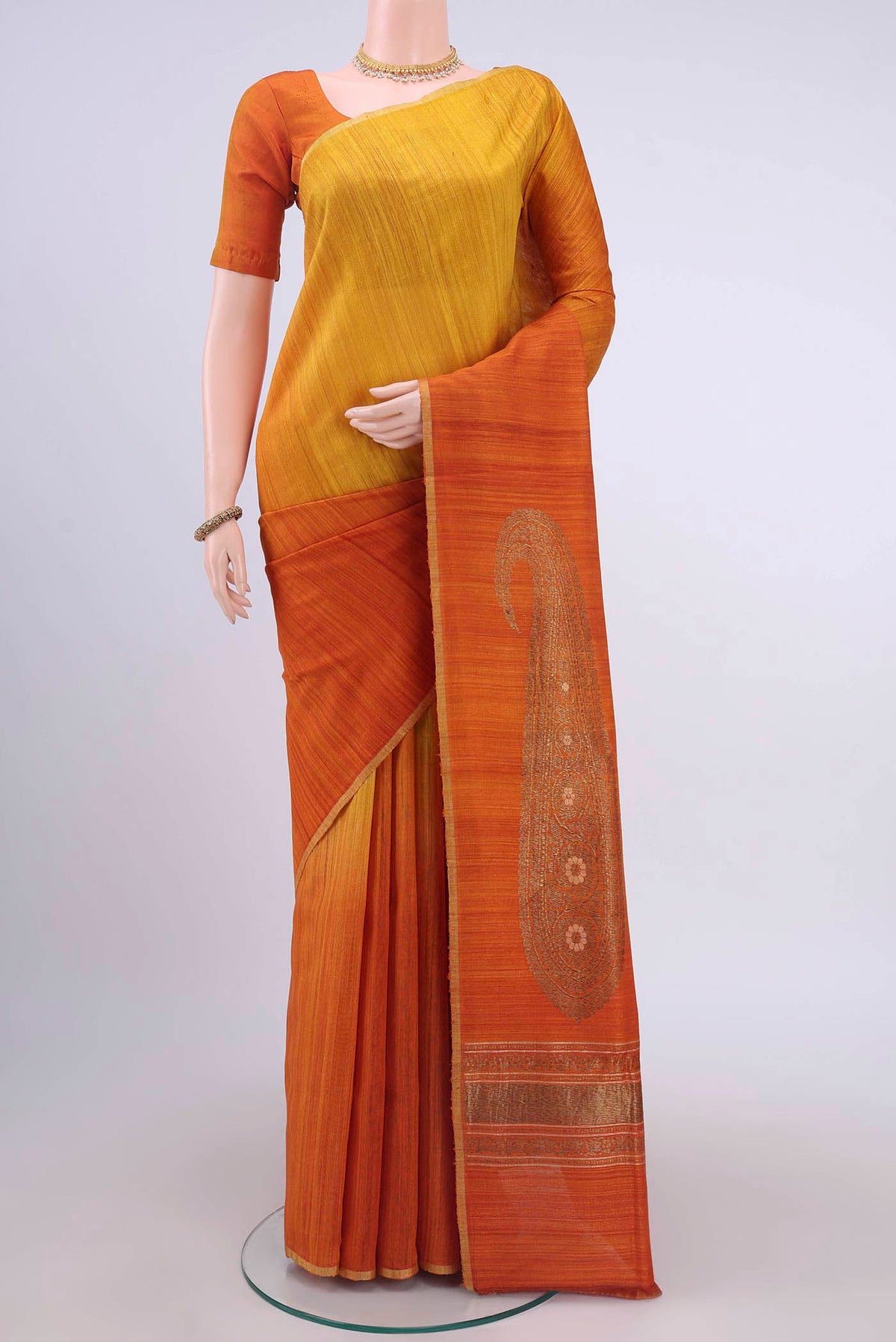 Yellow Dual Tone Banarasi Raw Silk Saree with Zari Butta on the body and Zari Border displayed on a mannequin