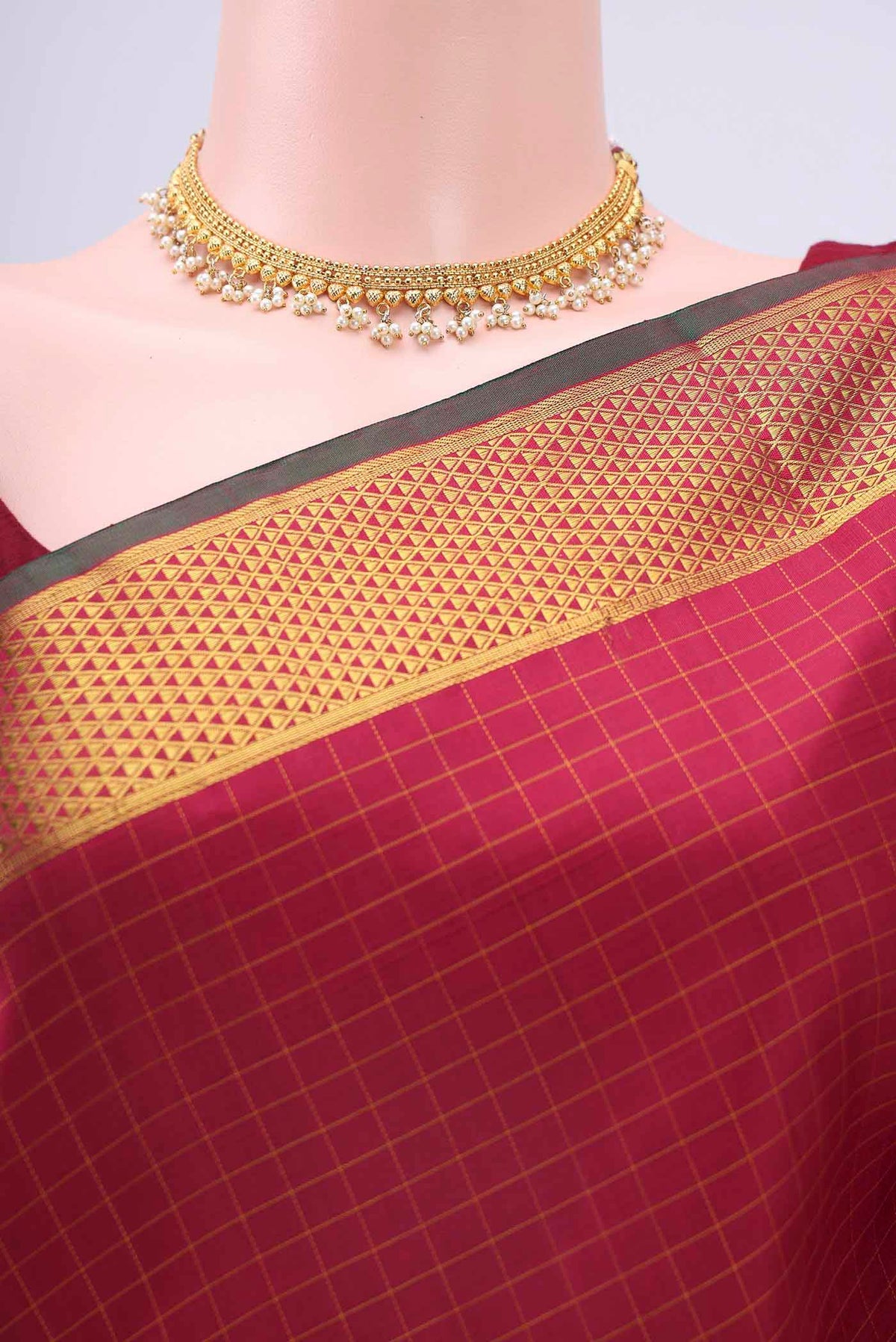 Border image of Maroon Kanchipuram Silk Saree with Checked design on the body and Zari Border
