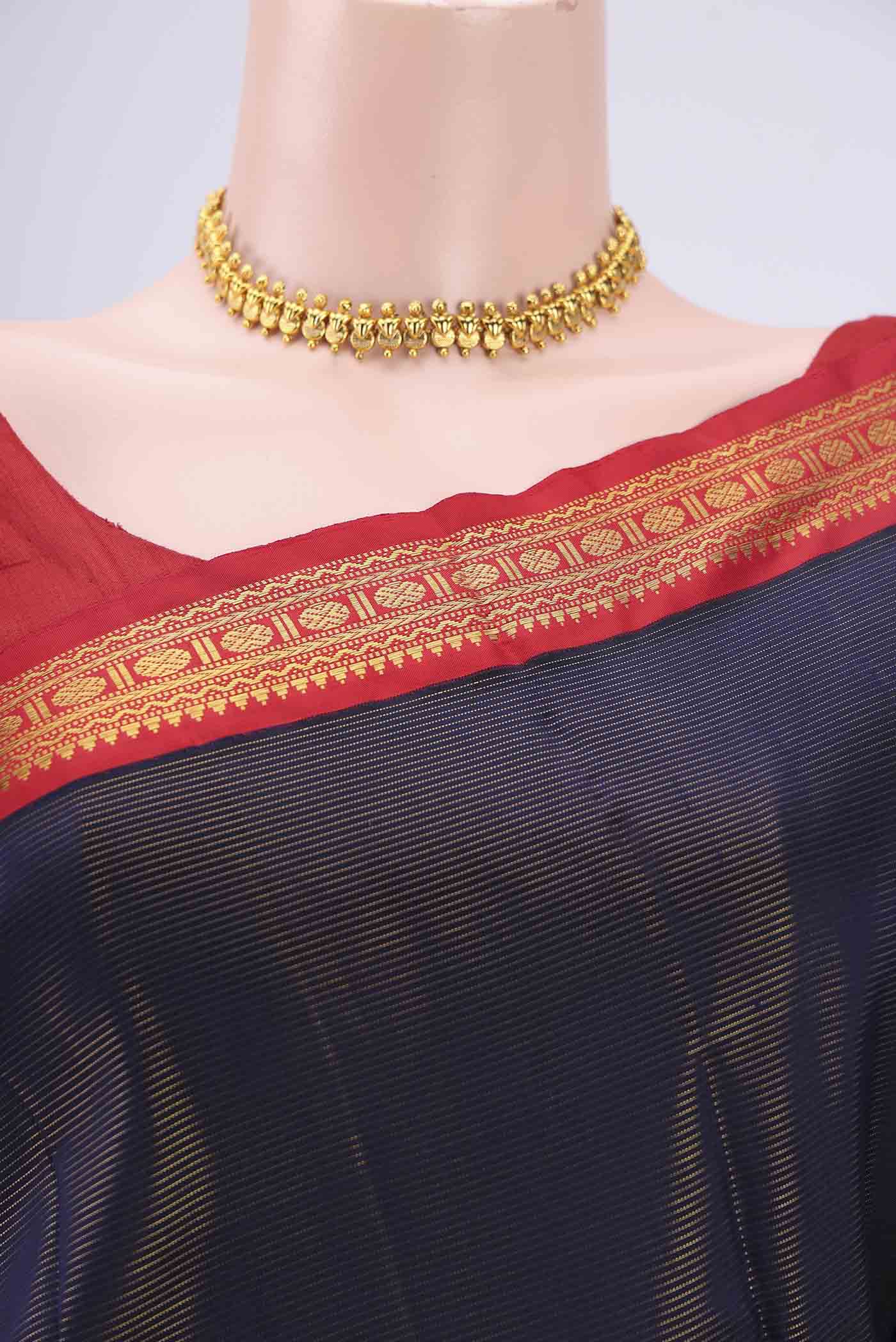 Border image of Navy Blue Kanjivaram Saree with Stripes on the body and Temple Border. 