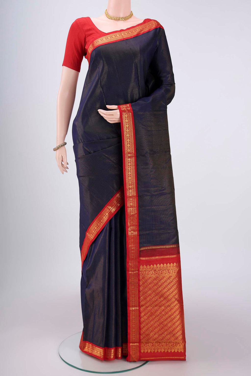 Navy Blue Kanjivaram Saree with Stripes on the body and Temple Border.  displayed on a mannequin